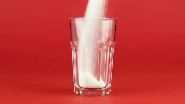 Pour Sugar Collins Glass Shot Thick Bottom Red Contrasting Background. Concept alt