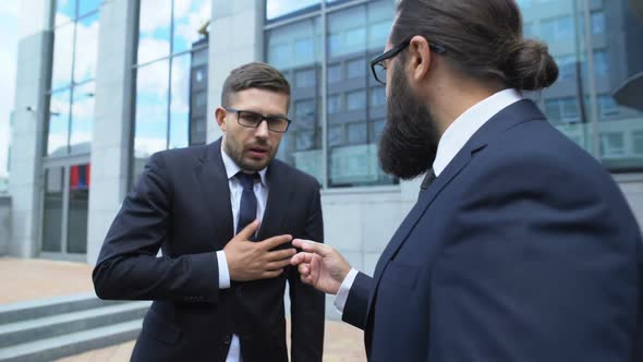 Business Man Feeling Pain in Chest Communicating With Colleague, Risk of Stroke