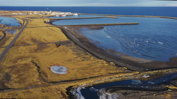 Aerial Over the Bay with a Few Ships and Bayside Road on an Icelandic Coast alt