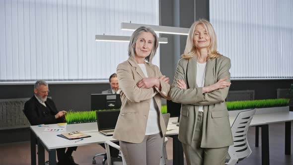Zoom in Portrait of Two Confident Professional Elderly Business Ladies in Formal Wear Posing at alt