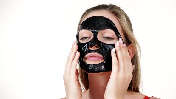 Girl Removes Black Mask from Face