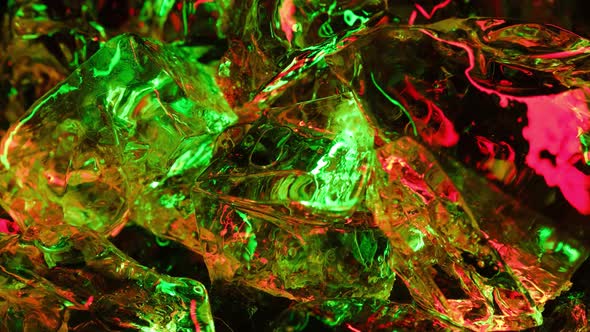 Bright and Beautiful Colors of Different Luminous Ice Cubes of Frozen Ice on Abstract Background alt