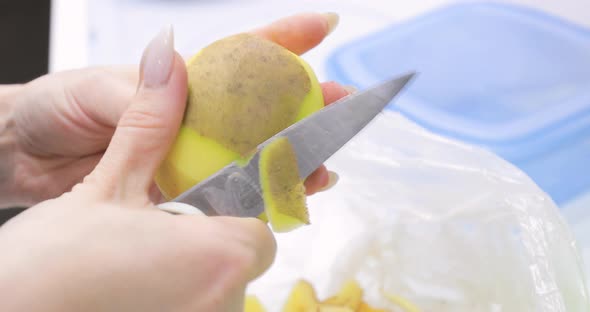 Cleaning Potatoes with a Knife