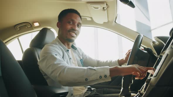 A Man Tests a New Car alt