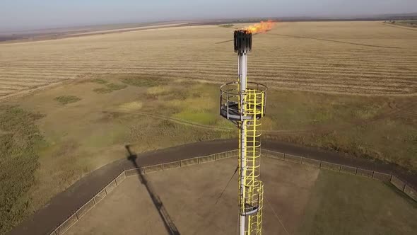 Panoramic Aerial View on Flare Stack and Oil and Gas Station in Field