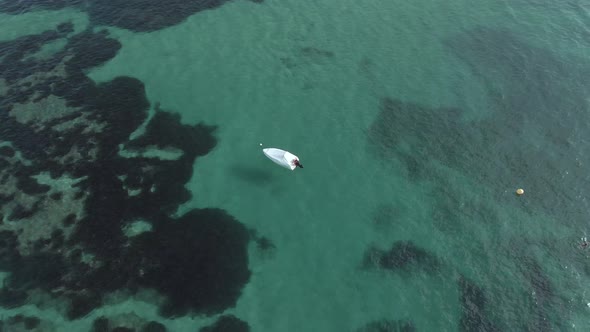 4k backward tracking aerial drone view of the boat harbor in the city of Calpe Spain Beach Coast 