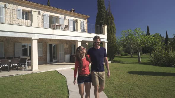 Couple Walking Through Country Estate alt