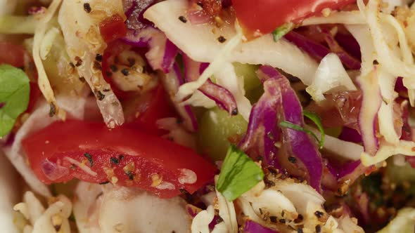 Salad Made of Marinated Cabbage Tomato Pepper and Carrot Closeup alt
