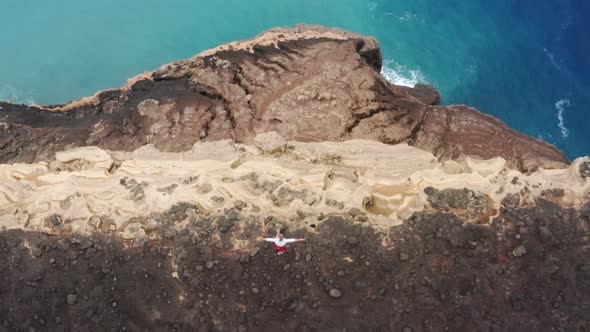 Man Standing on Cliff at Atlantic Ocean of Capelinhos Volcano Faial Island alt