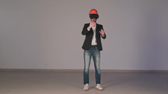 Male Engineer Wearing Virtual Reality Googles Developing Construction Project alt