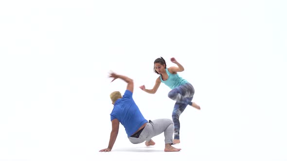 Woman and Man Are Practicing Capoeira in White Background of Studio. Afro-Brazilian Martial Art That alt