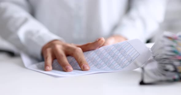 Woman Hand Crumpling Document with Numbers at Table  Movie Slow Motion alt
