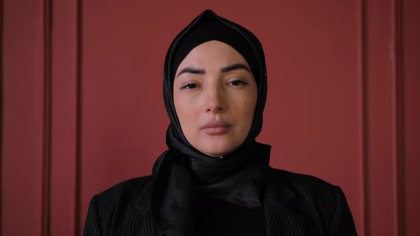 Muslim Arabian Independent Woman in Hijab Looking at Camera