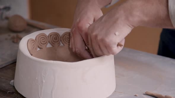 Adult Sculptor Making Ceramics in Workshop Studio