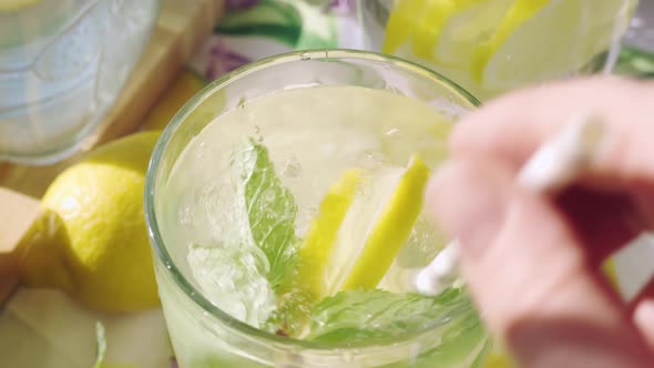 Macro Shot of Mouthwatering Soda Water with Ice in a Glass