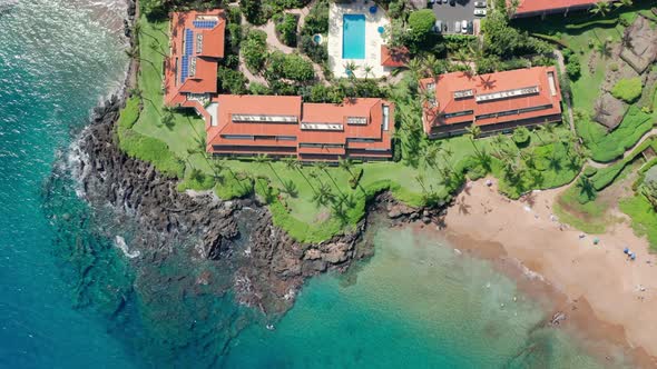 Aerial Villas on Scenic Coast with Coral Reef in Clear Bluegreen Water Hawaii alt