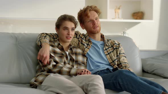 Married Couple Watching Horror Movies at Cozy Home alt