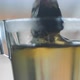 Tea bag in glass cup slow motion 