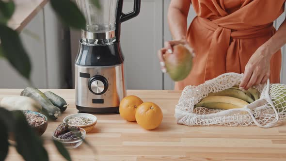 Vegetarian Woman Getting Ready to Make Smoothie alt