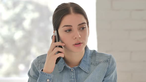 Young Woman Talking on Phone alt