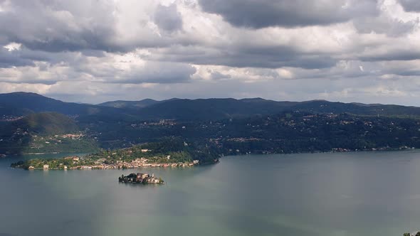 Isola di San Giulio or Saint Julius island on Orta lake in Piedmont, Italy. Zoom out alt