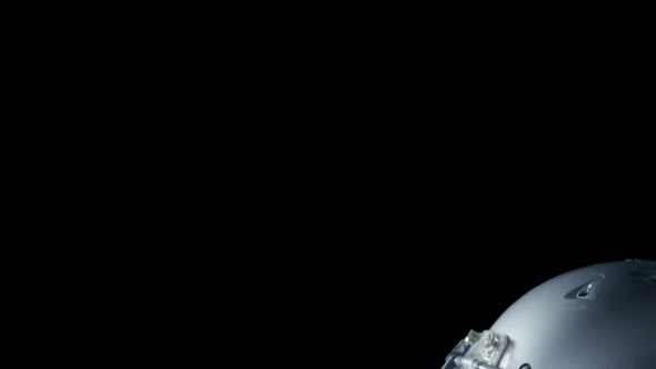 American football head gear and football on artificial turf 4k alt