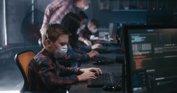 Student and Teacher Discussing Programming in School alt