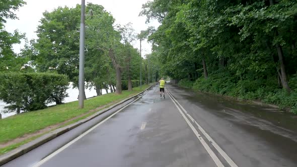 Middle-aged Man, Practicing Roller Skiing with Sticks alt