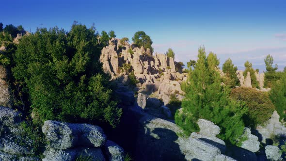 Majestic Scenery with Rock Formations and Coniferous Trees on a Summer Day alt
