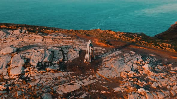 Aerial view around the Monument to King Arthur in Britain Monument close up on sea background