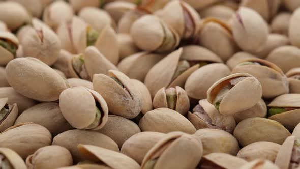 salt pistachios nuts close up. Pistachio nuts in the peel. Whole nut kernels alt