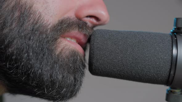 Young Bearded Vocal Coach Teaching How to Sing Online to His Audience  Slow Motion alt