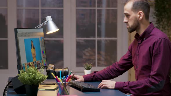 Bearded Professional Photographer Working in Editing App alt