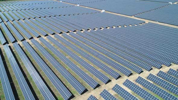 Aerial View of Solar Power Station Field at Sunny Day. Aerial Top View of Solar Farm. Renewable alt
