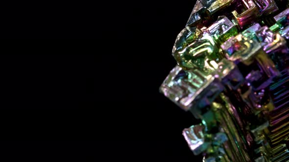 Amazing Colorful Rainbow Bismuth Gemstone Macro Closeup Isolated on Black Background. alt