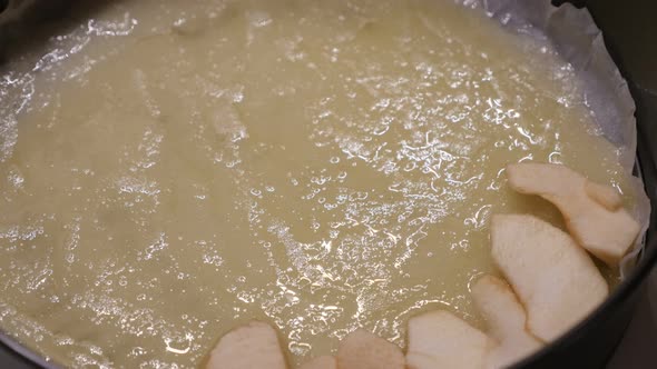 Fruit pieces in baking tray 4K 2160p 30fps UltraHD footage - Close-up of apple pie detailed preparat alt