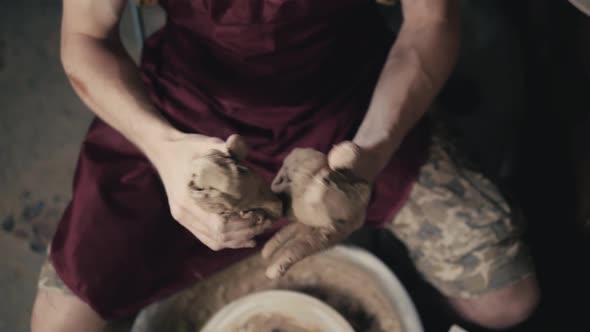 Serious Woman Working at Pottery Wheel in Studio Prepare Clay to Make Plate to Restaurant alt