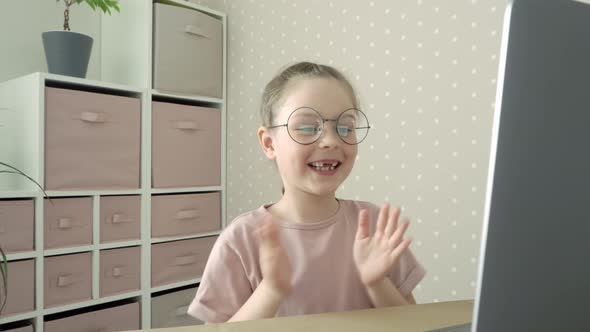 First Grader Laughs and Claps His Hands