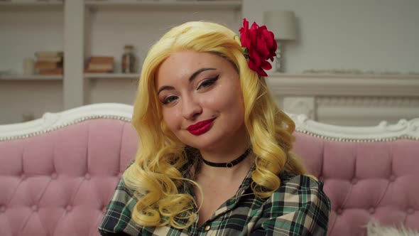 Attractive Positive Woman in Cosplay Costume Making Ok Gesture Indoors alt