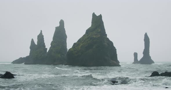 The Cliffs and Waves at the Black Sand Beach Reynisfjara in Vik Iceland alt