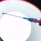 Shooting of Syringe Needle with Drop of Blood on the White Background - VideoHive Item for Sale
