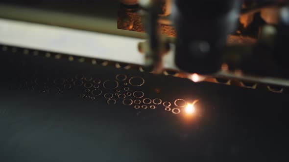 Laser Cutting Mirror, the Close-up. The Carving on the Mirror Using the Laser System of Patterns and