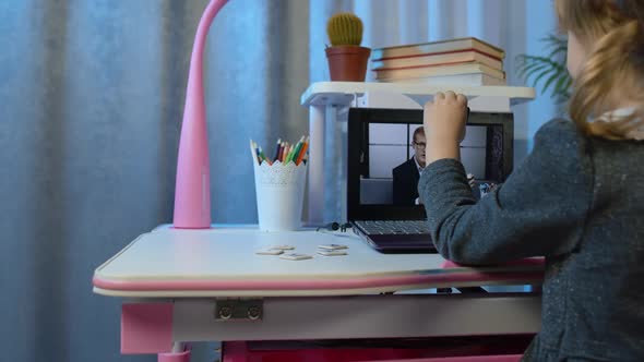 Preschool Child Girl Distance Online Education at Home Pupil Watching Video Lessons on Laptop alt