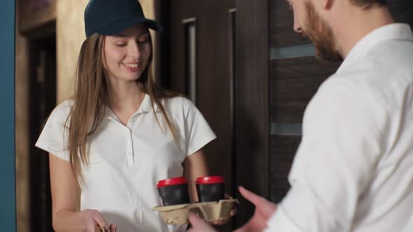 Delivery, Mail and People Concept - Happy Woman Delivering Coffee and Food in Disposable Paper Bag alt