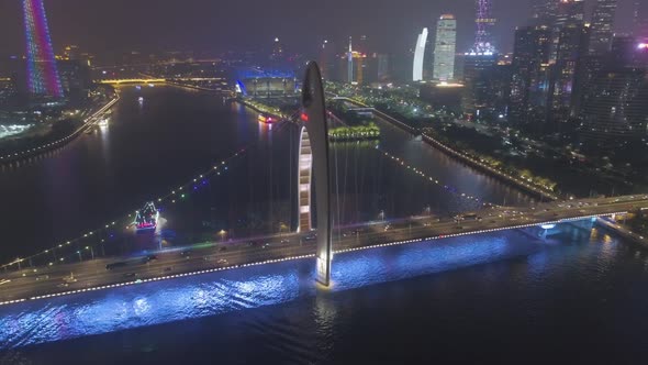 Liede Bridge on Pearl River and Guangzhou Cityscape at Night. China. Aerial View alt