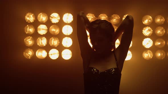 Girl Model Posing Sexually in Spotlights Close Up alt