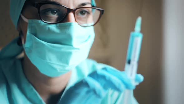 Conceptual video of a doctor holding a syringe with the coronavirus COVID-19 vaccine.