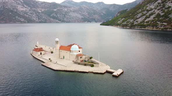 Restored Church with Red Roof and Tower on Island