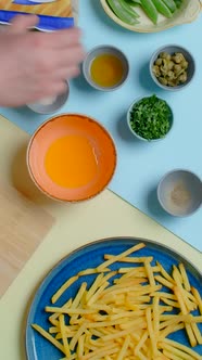 Vertical Flat Lay Video Chef Cooks Sauce for the French Fries