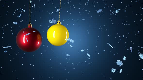 Christmas decorations balls slowly move against the background of snowflakes.